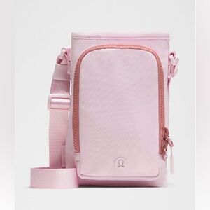 lululemon water bottle crossbody with front pocket - blissful pink